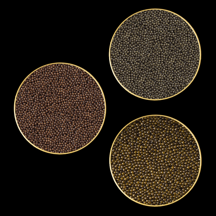 three open gold tins of black caviar
