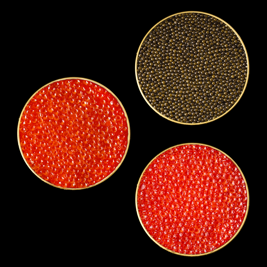 three tins of different colored caviar